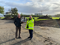 Work is underway to lay the foundations for the 'Shipbuilders of Port Glasgow' sculpture at Coronation Park. Pictured are councillors Michael McCormick and Robert Moran with a maquette of what the sculpture will look like
